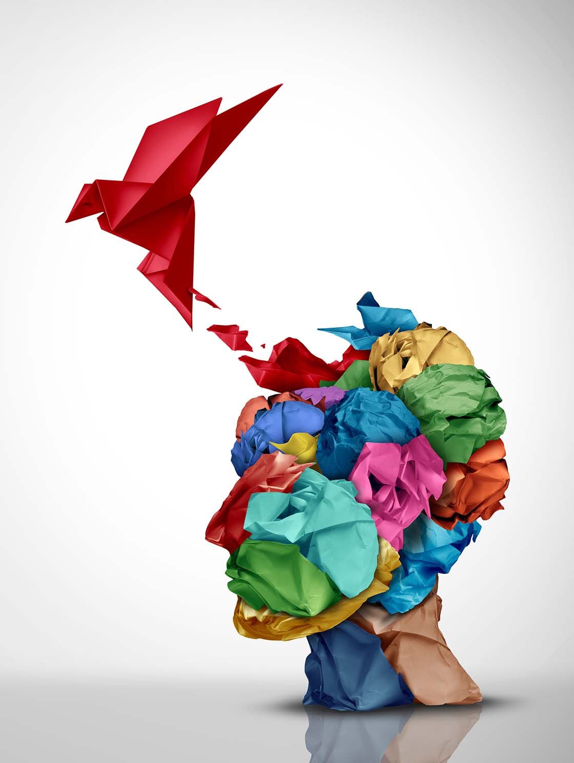 Barvna ilustracija možganov iz papirja, iz katerih poleti rdeča origami ptica – simbol svobode misli in izgube spomina pri demenci